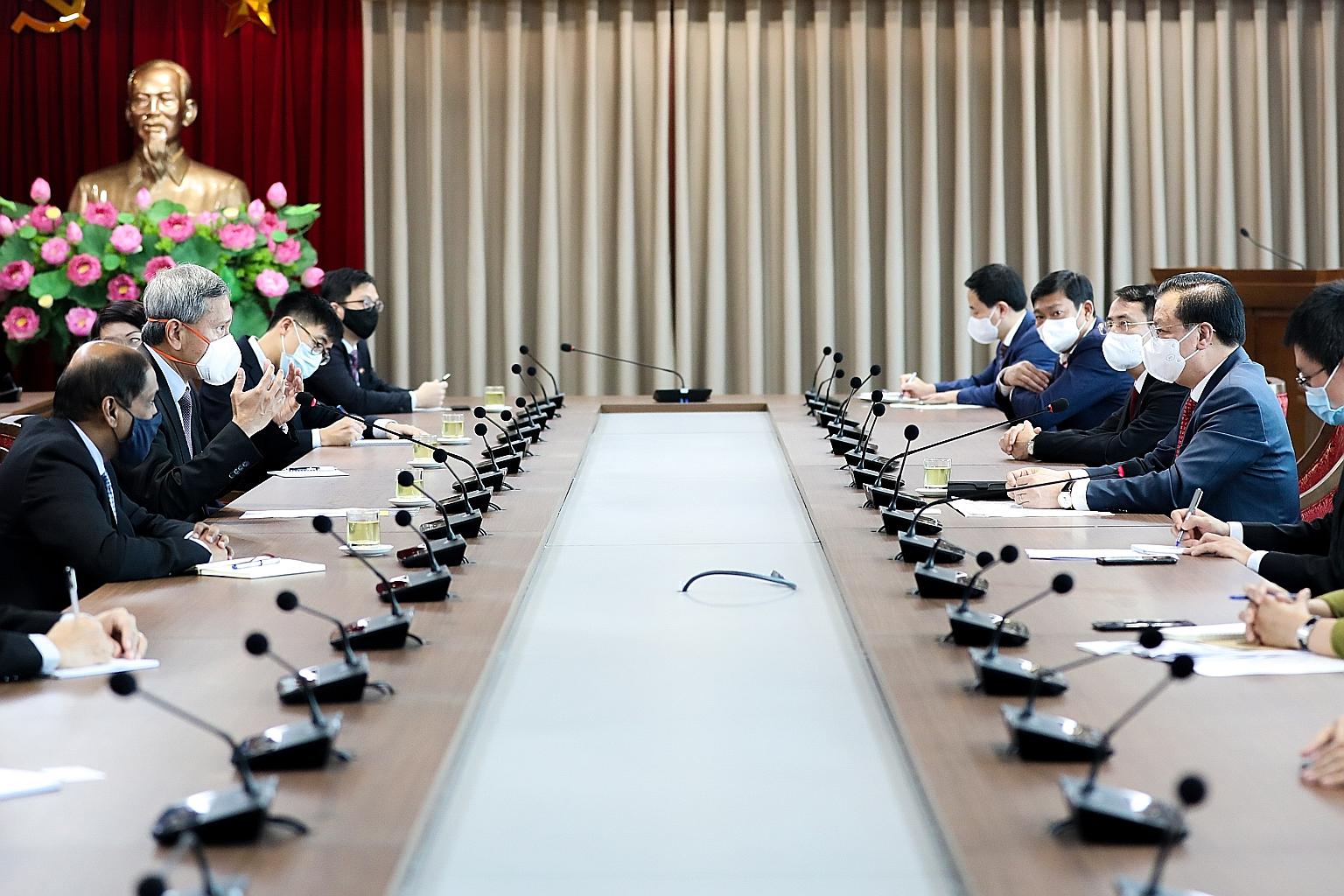 Singapore's Minister for Foreign Affairs Vivian Balakrishnan speaking during a meeting with Hanoi Party Committee Secretary Dinh Tien Dung on Tuesday.