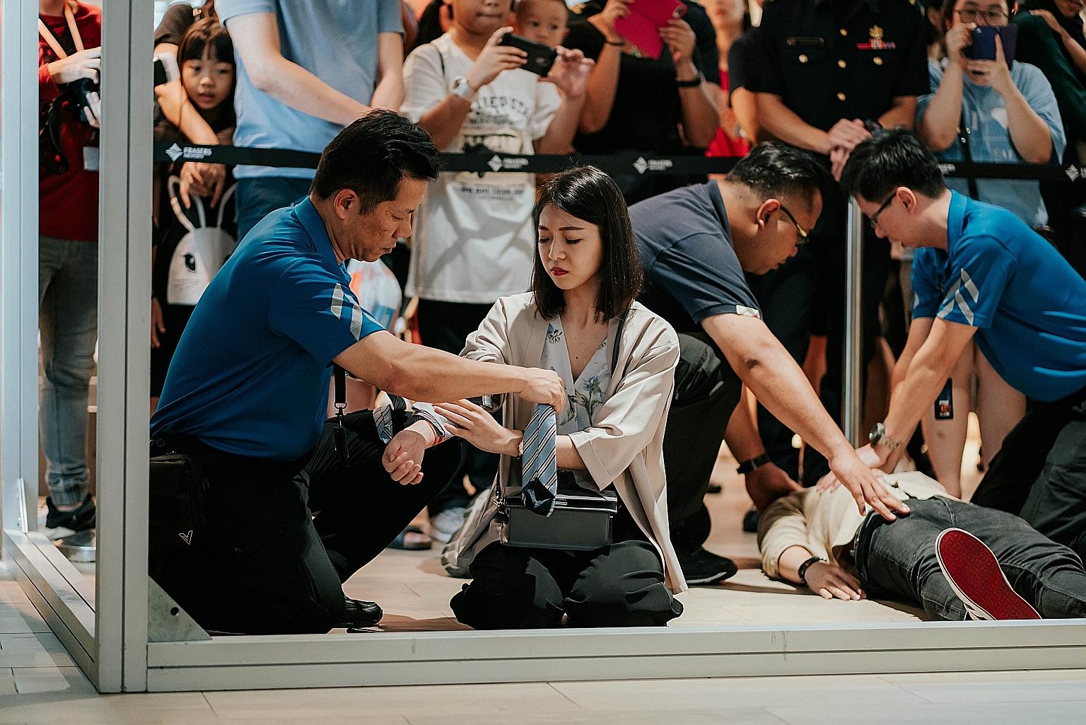 Participants in a simulated terror attack during an SGSecure roadshow at Punggol Waterway Point in 2019. Under the SGSecure programme, the proportion of residents with some emergency skills has increased from 40 per cent in 2017 to 62 per cent in 201