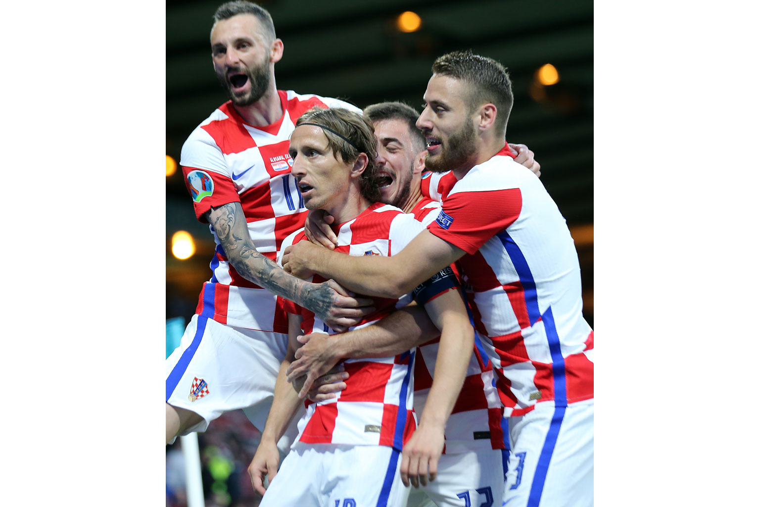 Croatia's Luka Modric (centre) celebrating with teammates after scoring his team's second goal in the 3-1 win over Scotland on Tuesday. The victory meant that Croatia are through to the round of 16.