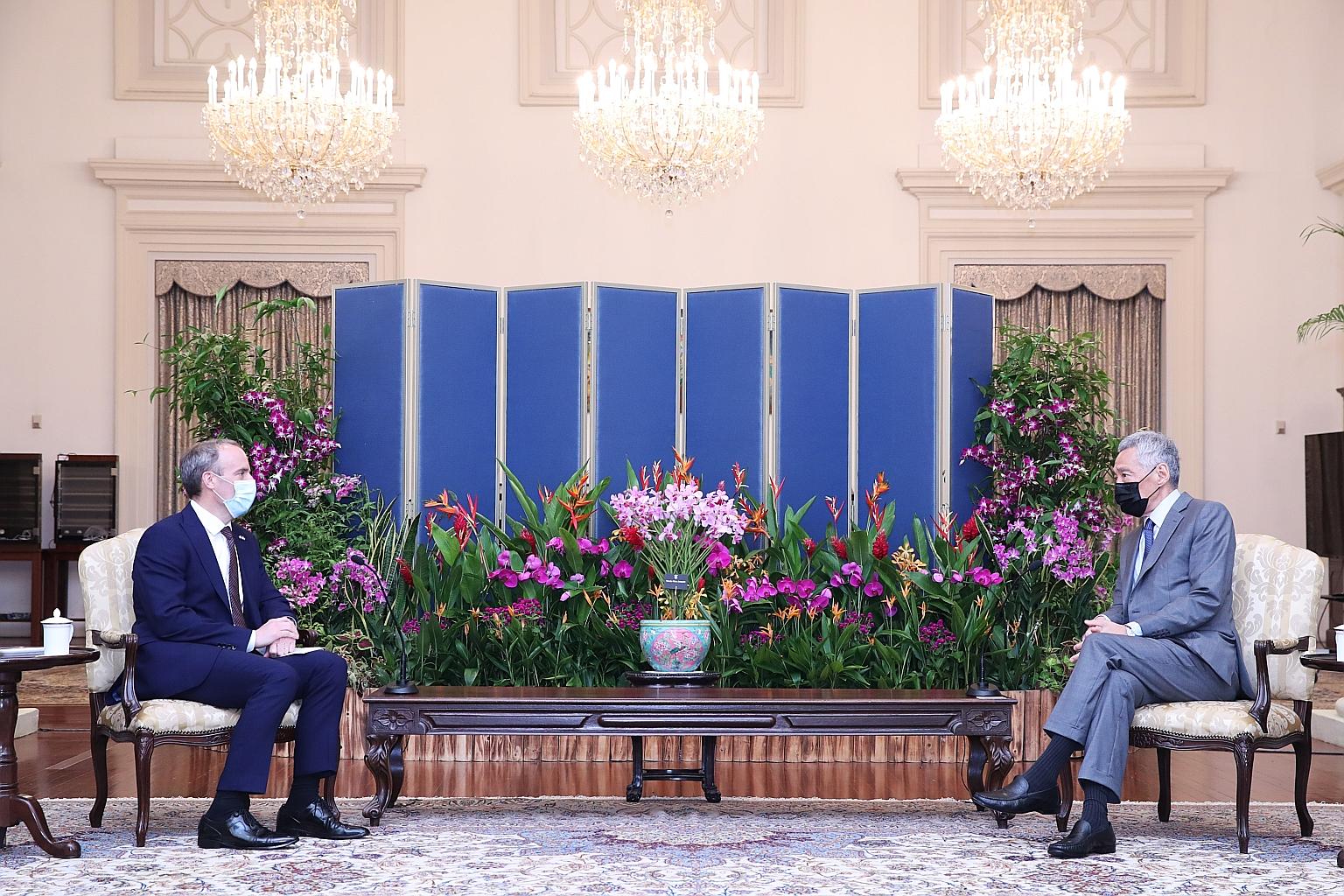 In Singapore yesterday, United Kingdom Foreign Secretary Dominic Raab (far left) met Prime Minister Lee Hsien Loong (left) and Minister for Foreign Affairs Vivian Balakrishnan as well as business representatives to discuss how supply chains can be mo