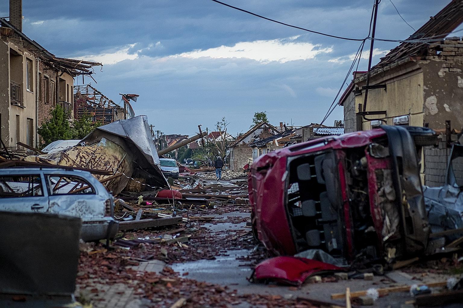 Buildings left damaged yesterday following a tornado in Moravska Nova Ves in the Czech Republic. The rare tornado on Thursday evening swept through the region of South Moravia in the south-eastern part of the country, destroying or damaging thousands