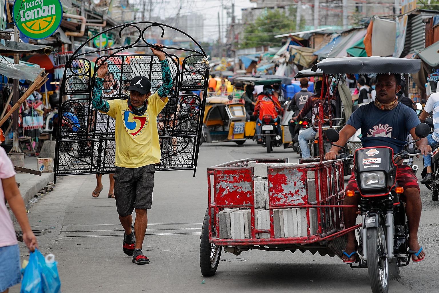 A market in the Philippine capital Manila. Analysts expect the country to post the largest fall in average annual GDP growth in the three years ending 2022, compared with 2019, the last full year before Covid-19.
