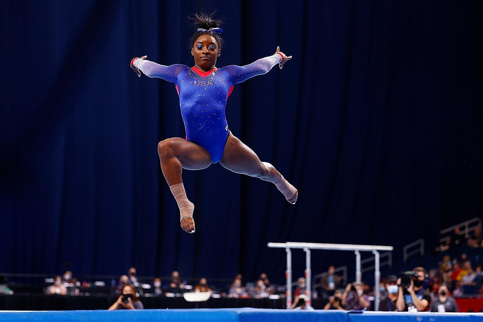 Simone Biles scored 15.366 in the floor competition and was ranked top overall after the first day of the women's competition at the US Olympic trials.
