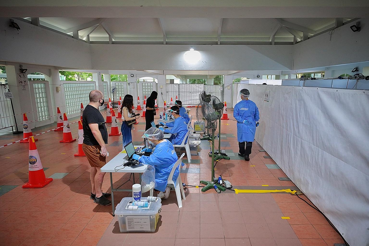 Mandatory Covid-19 testing for residents of Block 66 Eng Watt Street taking place at the pavilion at 2D Boon Tiong Road yesterday. The testing continues today from 9am to 4pm.