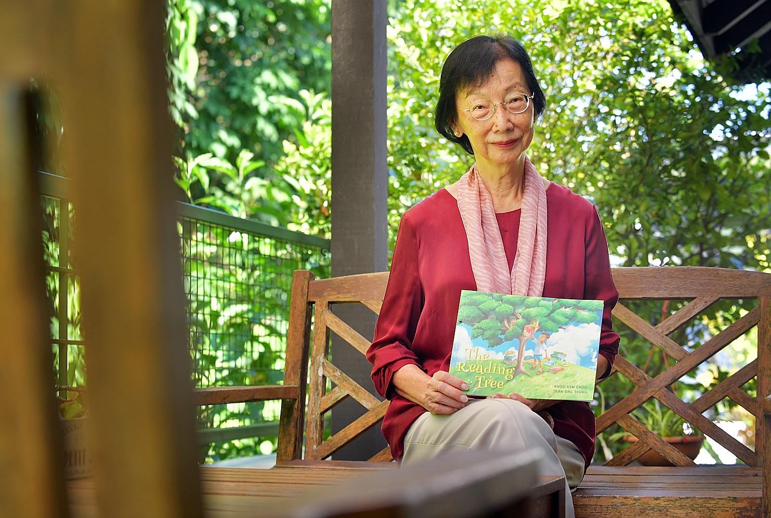 Dr Khoo Kim Choo, founder and director of the Preschool for Multiple Intelligences, with her new children's book The Reading Tree, about the friendship between a boy and a talking tree.