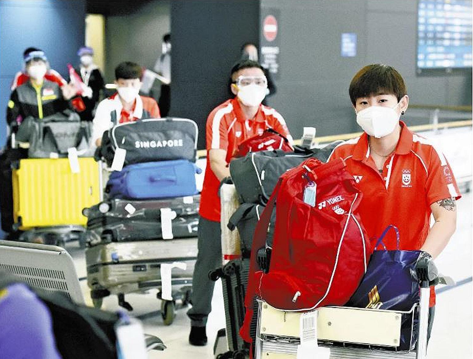 From far right: Singapore table tennis players Lin Ye, women's coach Hao Anlin and reserve player Zeng Jian and others arriving at the Chubu International Airport in Nagoya on Sunday. They were among a group of six, including sparring partner Goi Rui