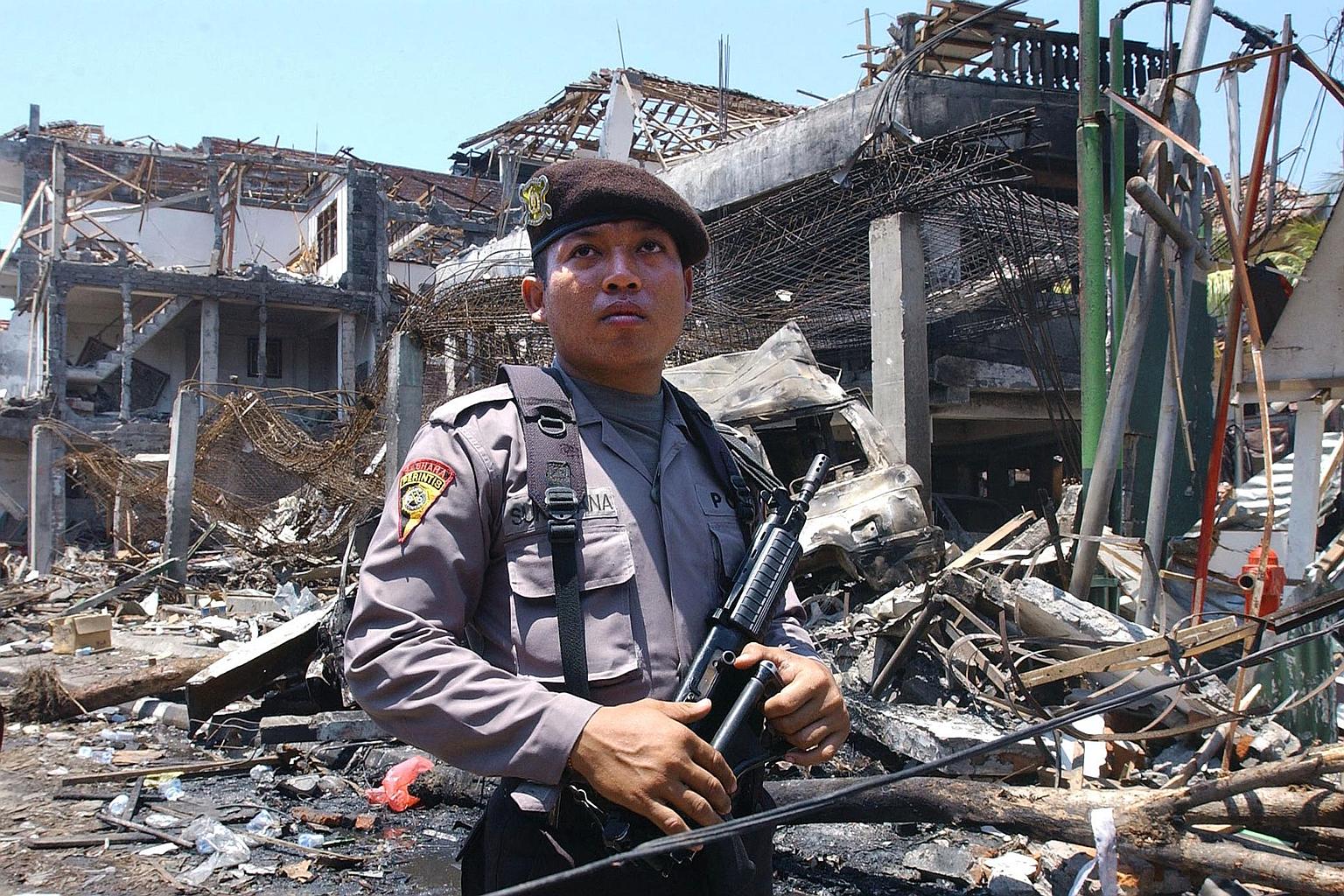 A 2002 photo of an Indonesian policeman in front of what remained of a club in Kuta, Bali, after a bombing in October that killed more than 200 people. The Bali bombing was the worst terrorist attack on Indonesian soil, and was allegedly planned by J