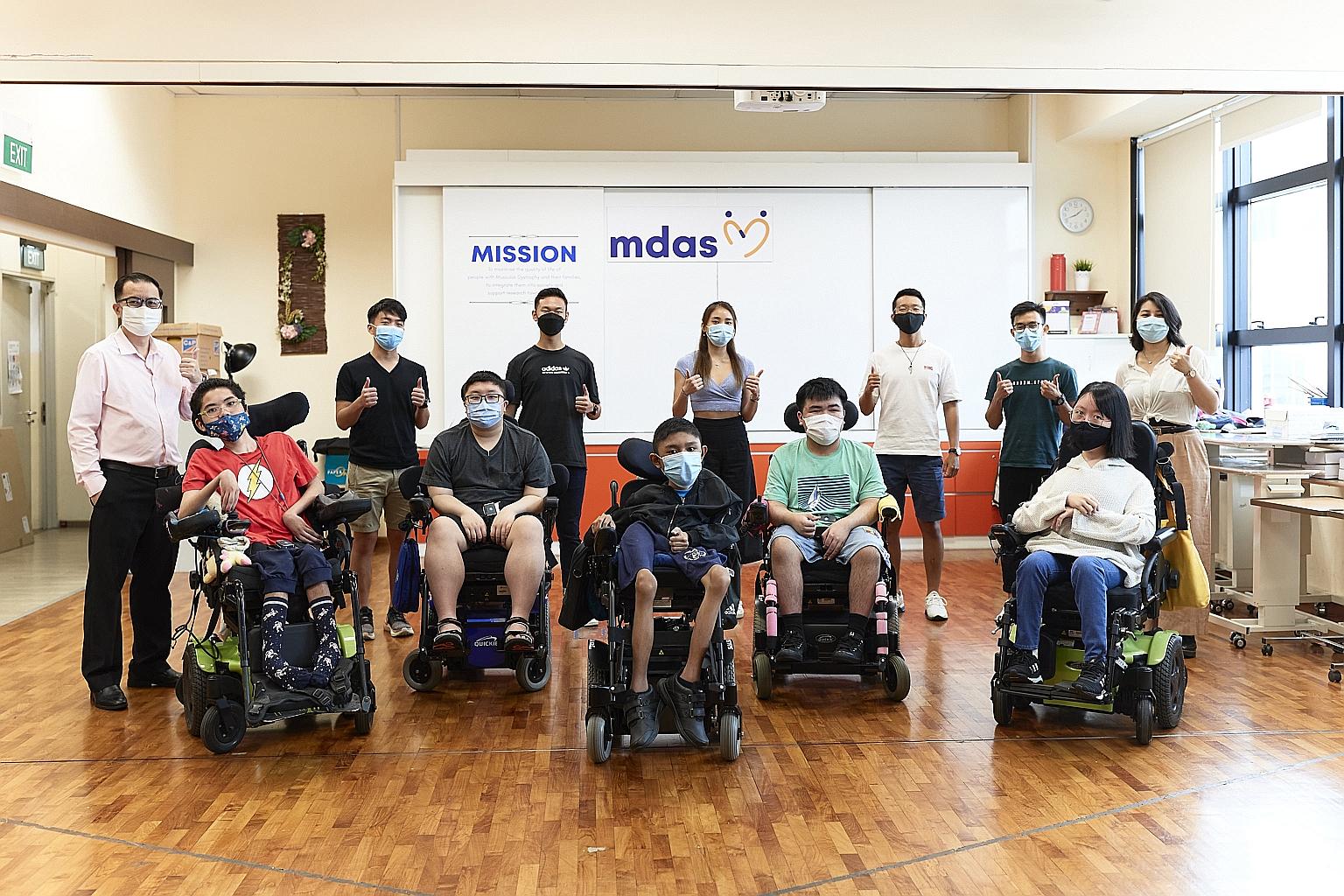 Members of The Ironman In You team at one of their visits to the Muscular Dystrophy Association (Singapore). The project, which aims to raise $100,000, includes a fitness challenge, where participants are to swim 500m, walk or run 2.5km, or cycle 10k