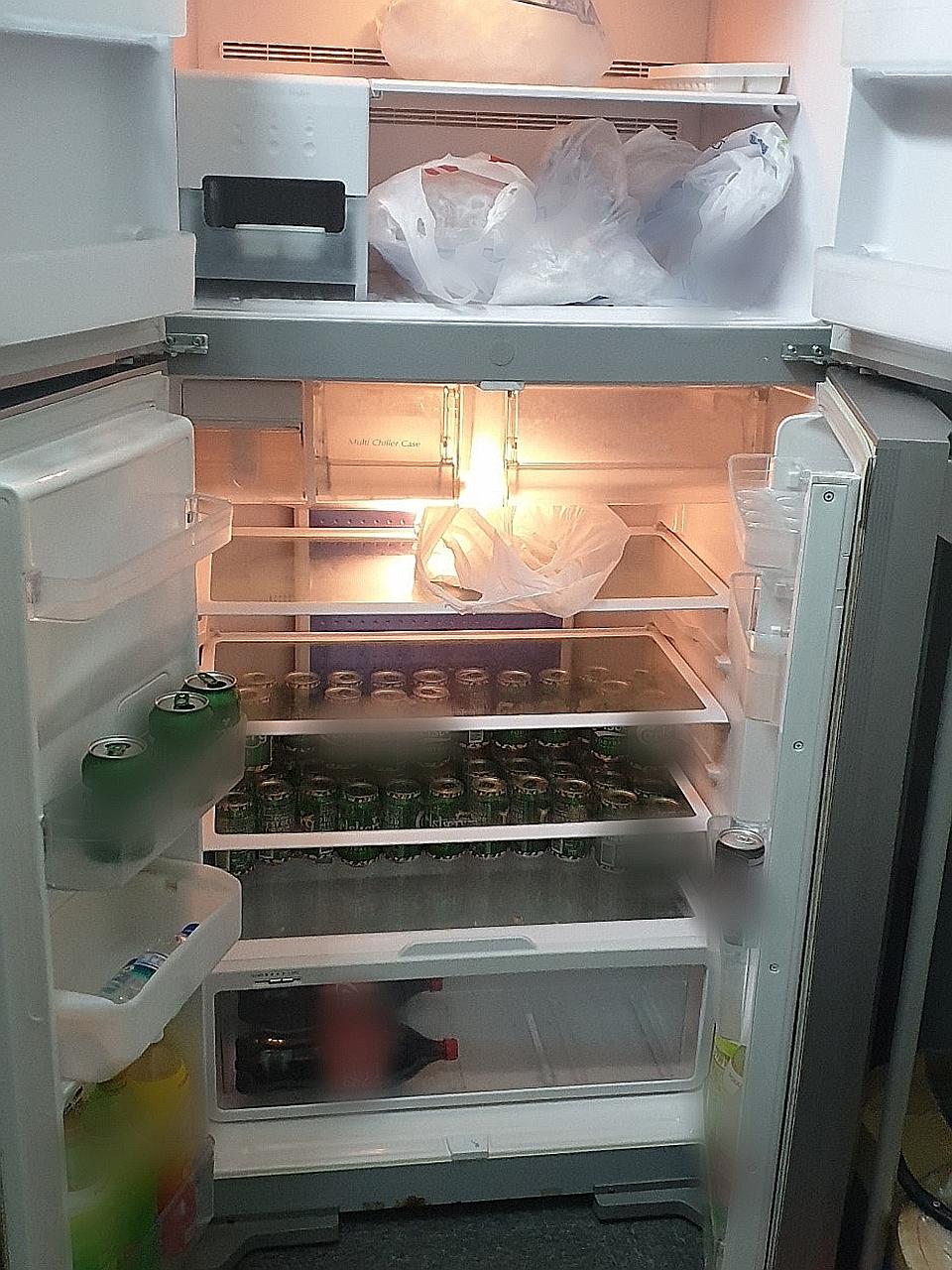 A refrigerator with cans of liquor and drinks was found at the unlicensed KTV outlet at Woodlands Industrial Park E1. Karaoke equipment, liquor bottles and beer cans were seized for investigations.