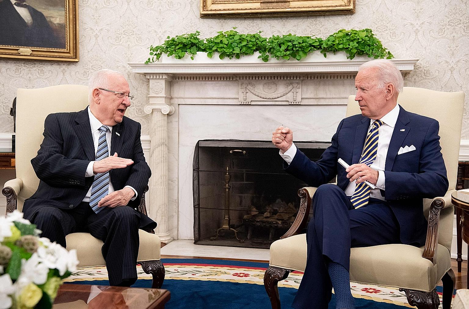 United States President Joe Biden (at right) at a meeting on Monday with visiting Israeli President Reuven Rivlin in the Oval Office of the White House, where Mr Biden said his commitment to Israel is iron-clad.