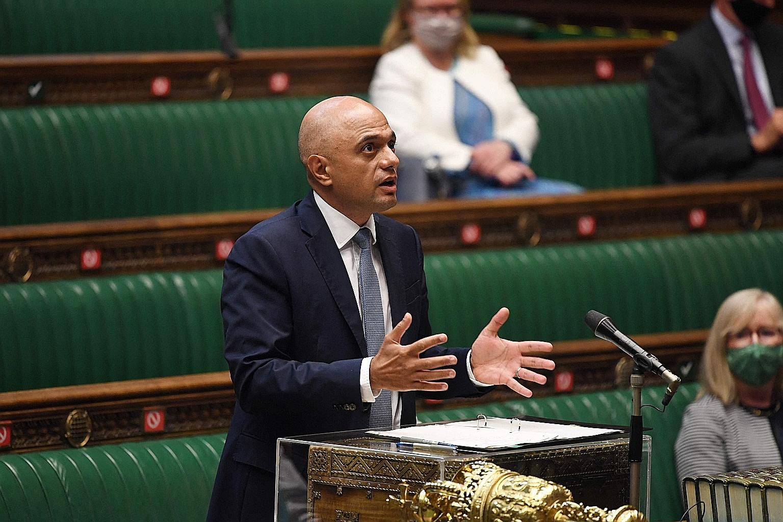 British Health Secretary Sajid Javid giving the latest Covid-19 update in the House of Commons on Monday. PHOTO: AGENCE FRANCE-PRESSE