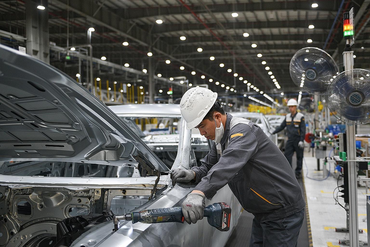 Workers at a car factory in Hai Phong City, Vietnam. Vietnam's gross domestic product is estimated to have expanded 6.61 per cent in the second quarter from a year earlier, faster than a revised gain of 4.65 per cent in the first quarter, the governm