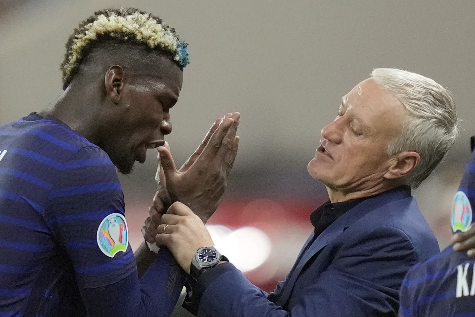 France coach Didier Deschamps speaking to Paul Pogba, who scored a stunner following Karim Benzema's brace, before extra time on Monday.