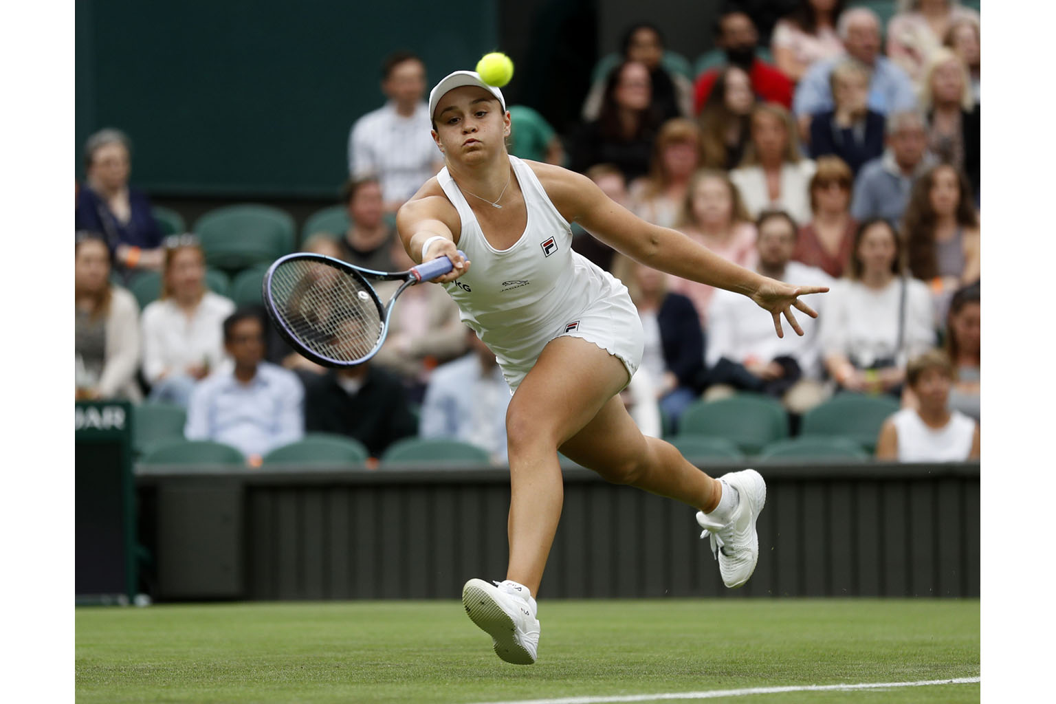World No. 1 Ashleigh Barty taking on Spain's Carla Suarez Navarro in the first round at Wimbledon yesterday. The Australian won 6-1, 6-7 (1-7), 6-1 after recording 38 winners to 12 from Suarez Navarro, including a 13-0 difference in aces. She also co