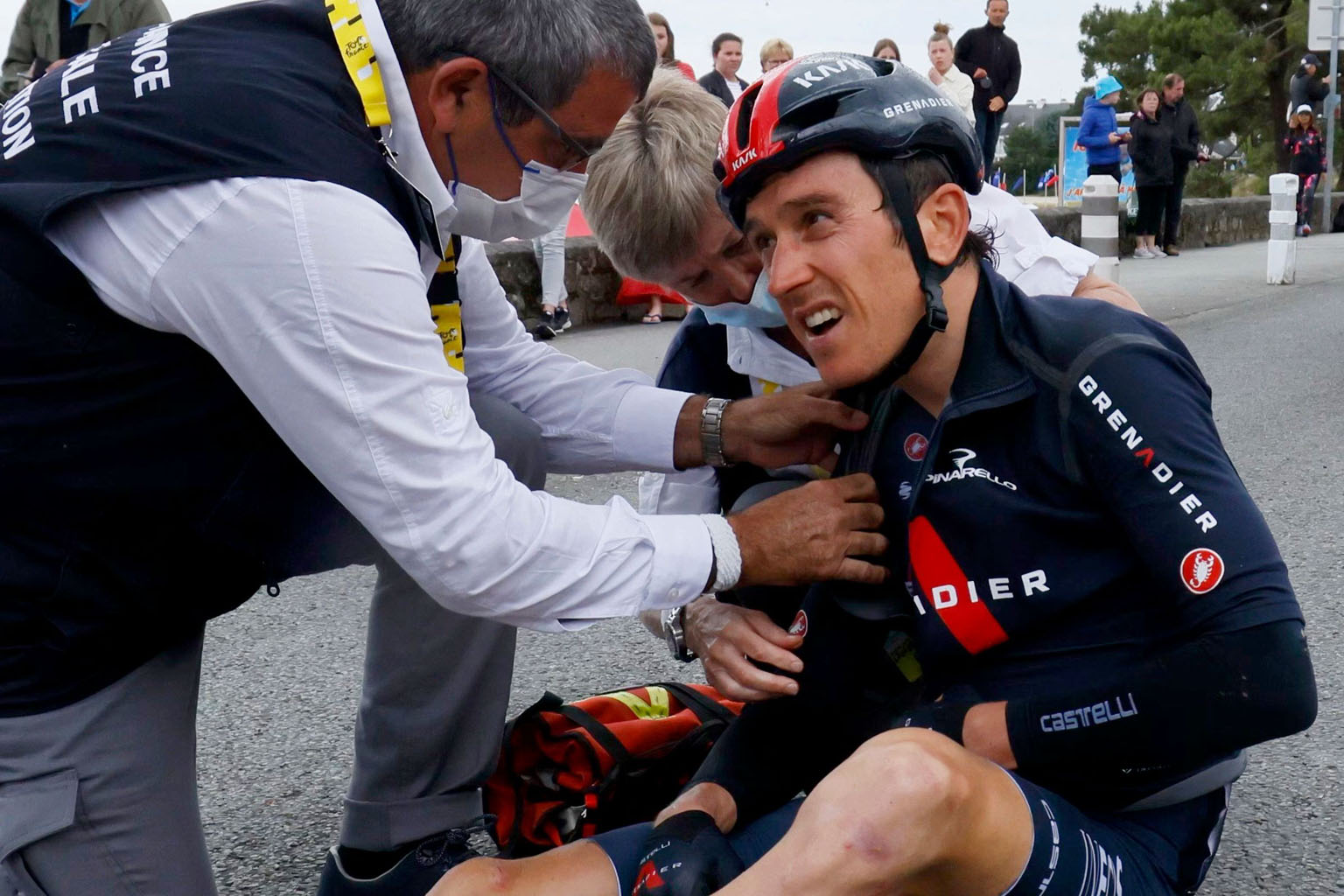 Team Ineos Grenadiers' Geraint Thomas receiving treatment during the third stage of the Tour de France on Monday. He dislocated a shoulder before making it back to the peloton with his teammates' help.