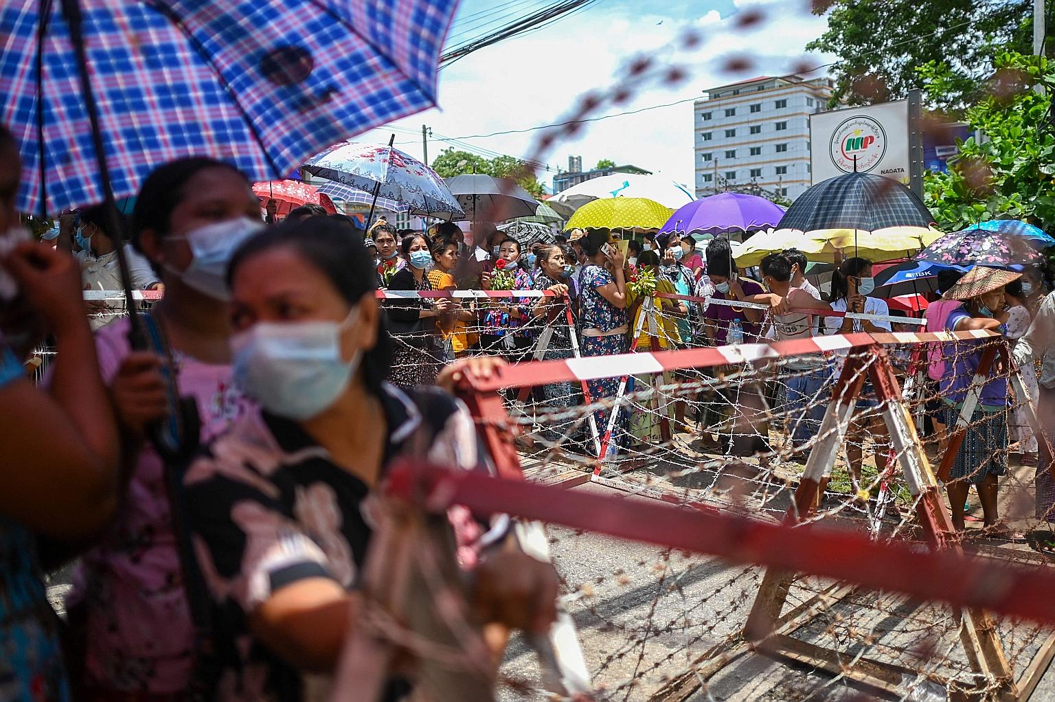 Relatives waiting outside Insein prison in Yangon yesterday before prisoners were to be released. The Myanmar Now news portal reported that across the country, about 2,000 prisoners would be freed. PHOTO: AGENCE FRANCE-PRESSE