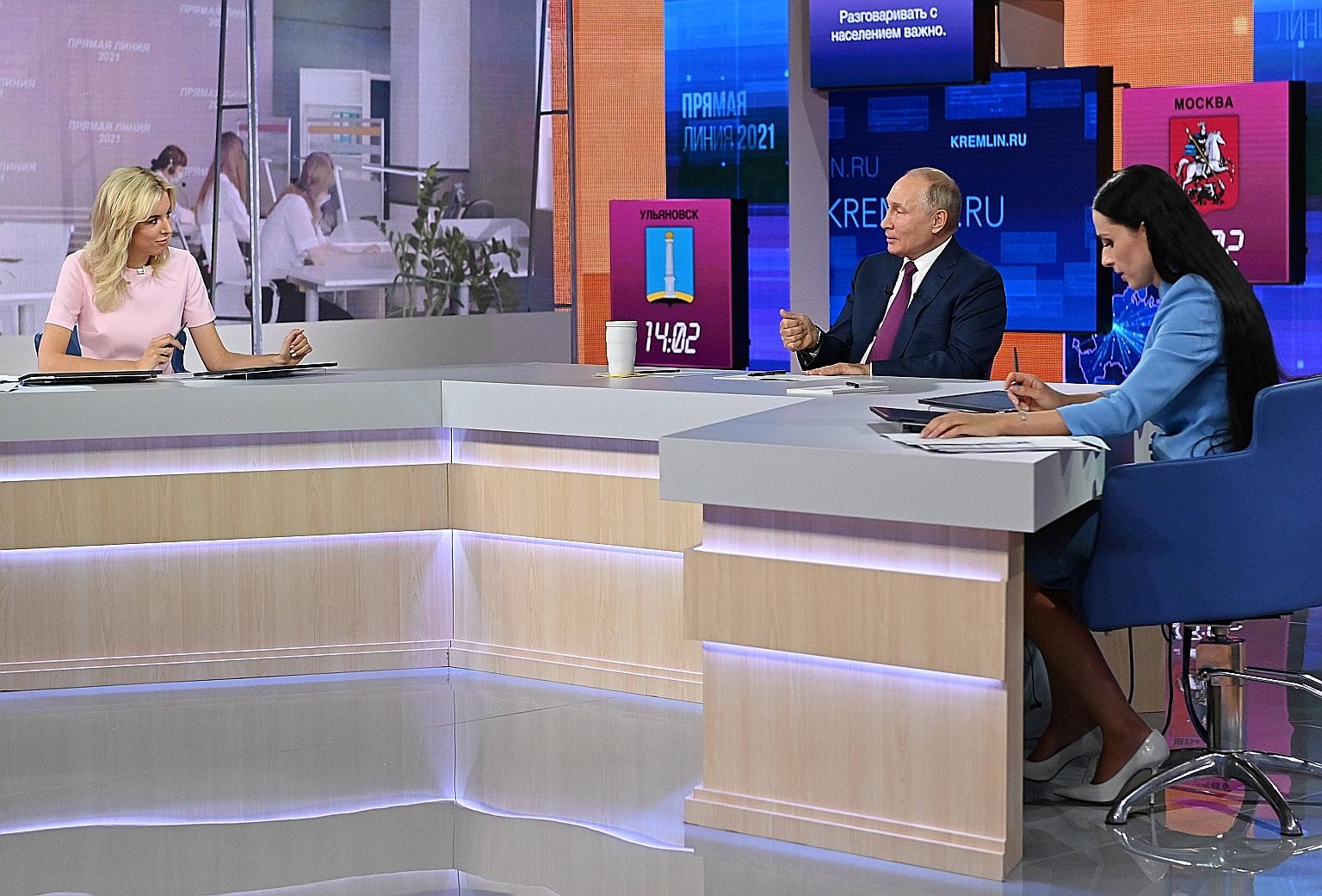 Russian President Vladimir Putin speaking during a live question and answer session on state television yesterday.