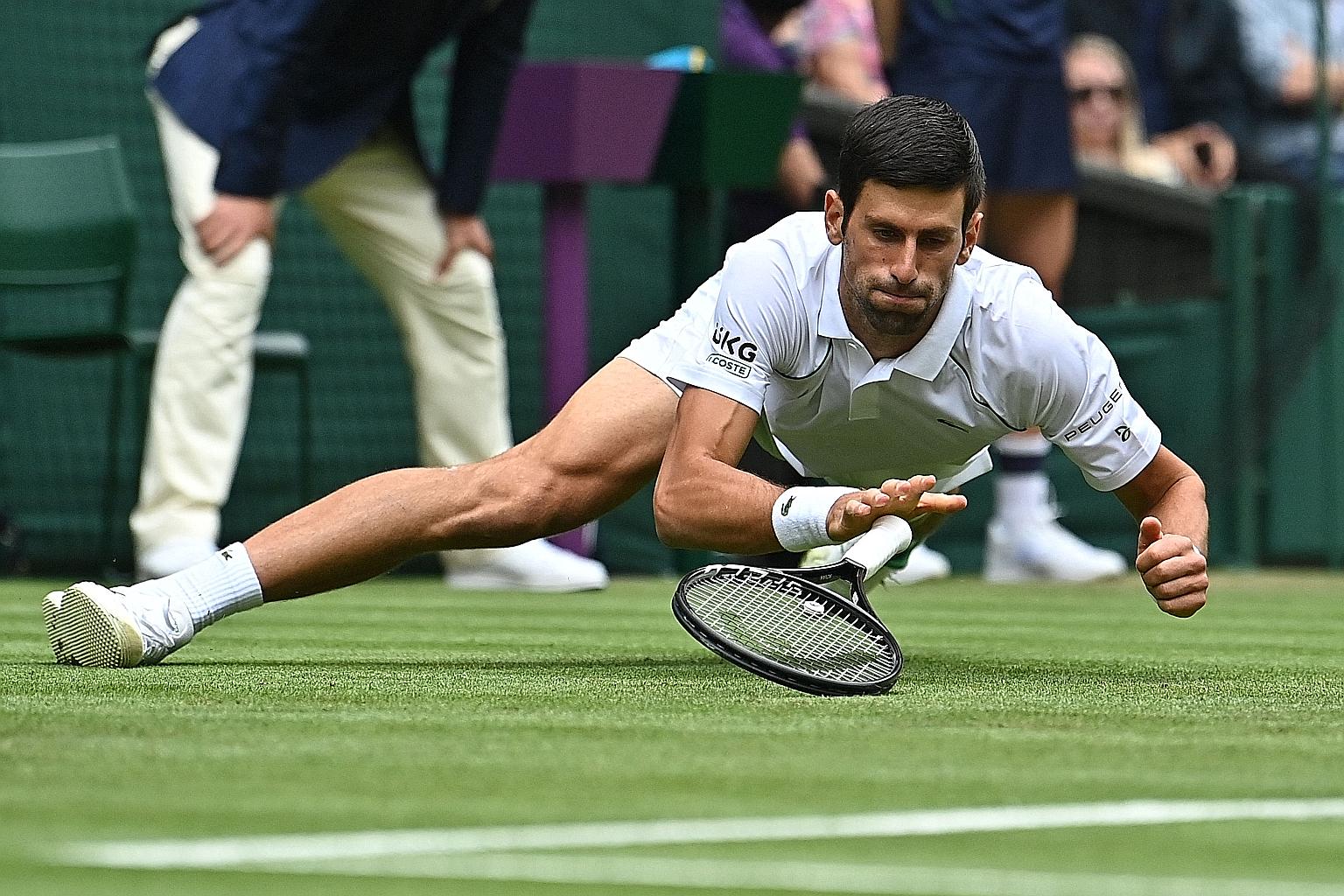 Novak Djokovic falling during his second-round match against Kevin Anderson yesterday. The Serb won 6-3, 6-3, 6-3.