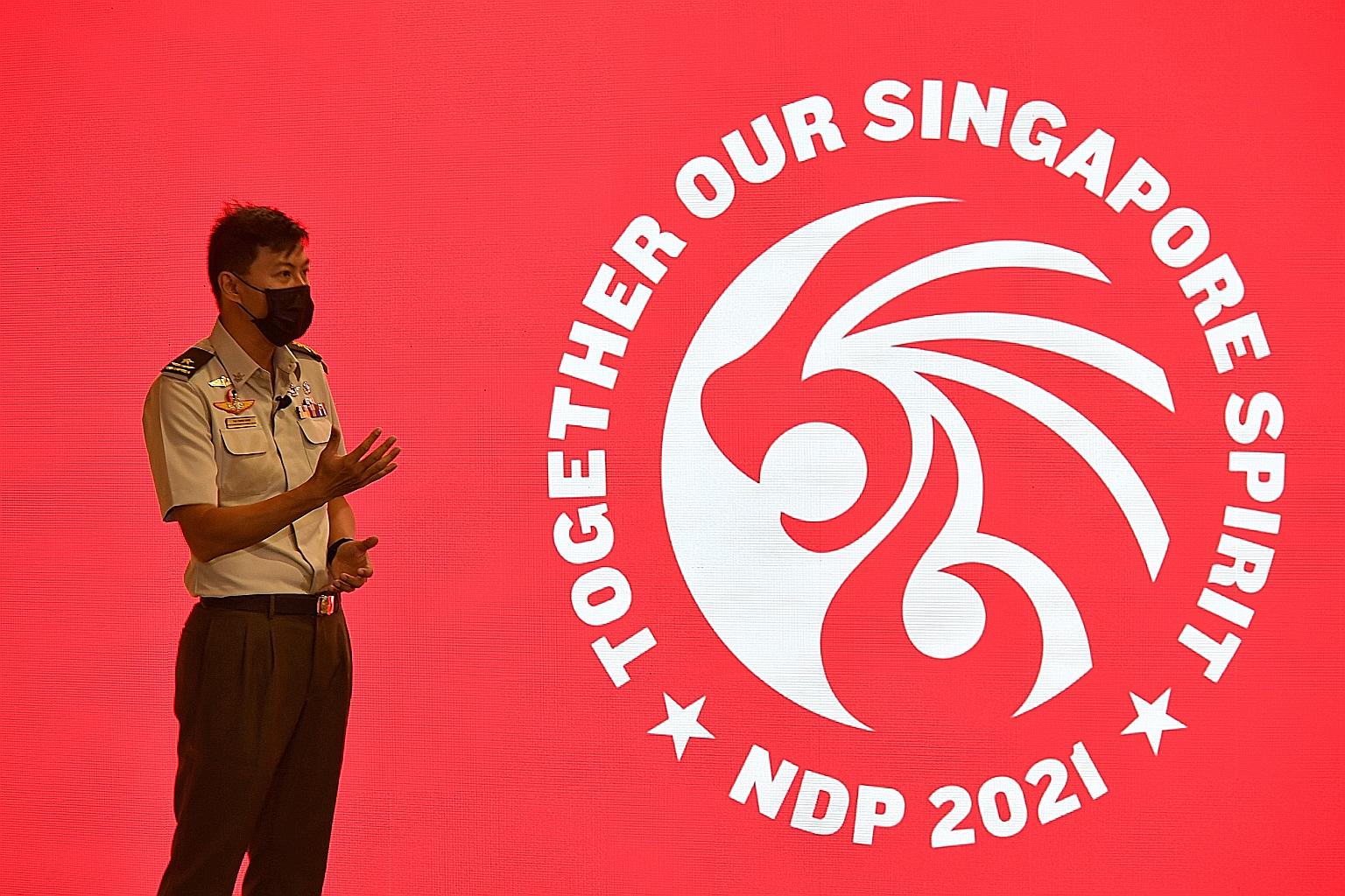 National Day Parade 2021 executive committee chairman Tan Cheng Kwee unveiling this year's logo at a media event yesterday at The Float @ Marina Bay. ST PHOTO: CHONG JUN LIANG