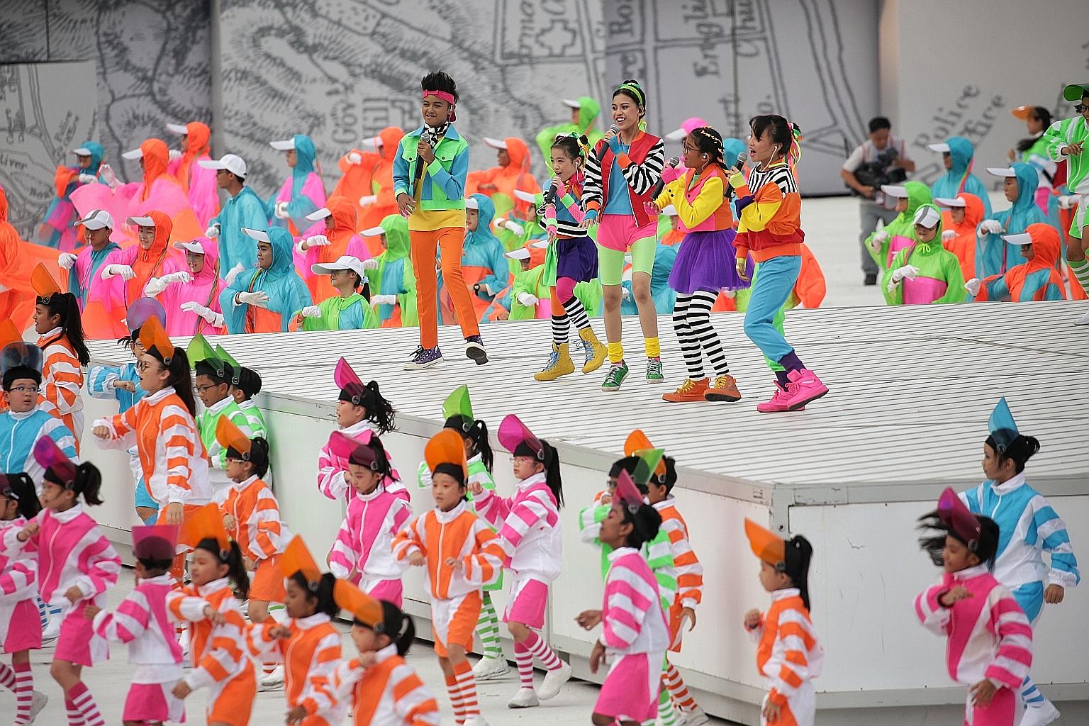 Above: Children singing the National Day Parade 2019 theme song, Our Singapore, in 2019. Minister for Culture, Community and Youth Edwin Tong urged youth to embrace religious and racial diversity. Right: Youth attendees at a virtual dialogue with Mr