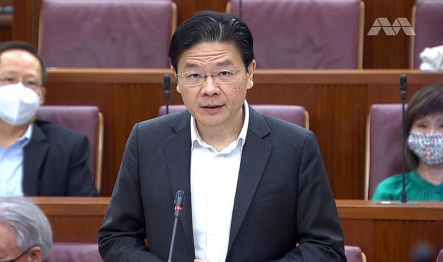 Finance Minister Lawrence Wong addressing Parliament. About half of the $1.2 billion will come from what was originally budgeted for the Deep Tunnel Sewerage System and the North-South Corridor. The rest will be reallocated from the under-utilisation
