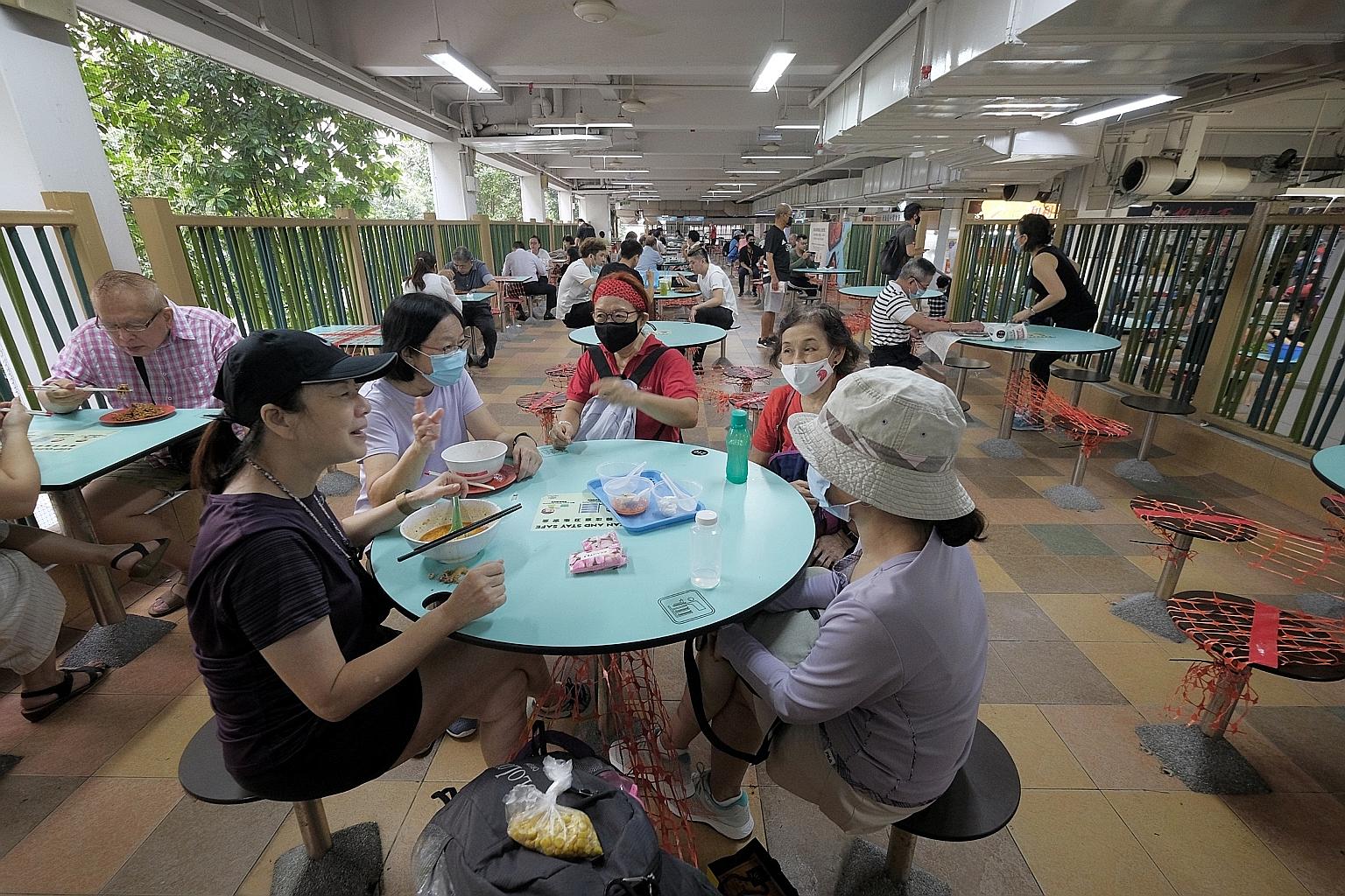 A group of five friends enjoying breakfast together at Hong Lim Food Centre after their morning walk yesterday.