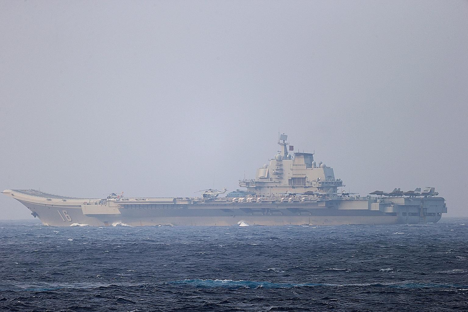 Chinese aircraft carrier Liaoning sailing through the Miyako Strait near Okinawa on its way to the Pacific on April 4. The annual White Paper from Japan's Defence Ministry says China has sustained high-level growth of its defence budget without trans