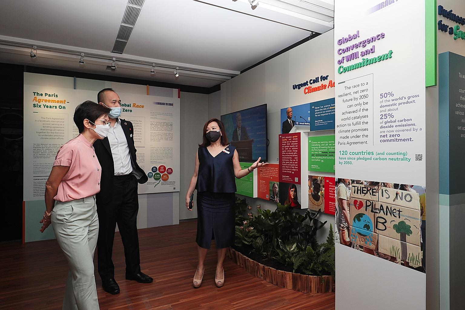 Minister for Sustainability and the Environment Grace Fu (in pink) with City Developments Limited (CDL) group chief executive officer Sherman Kwek and CDL chief sustainability officer Esther An on a tour of the exhibition at CDL's Green Gallery in th
