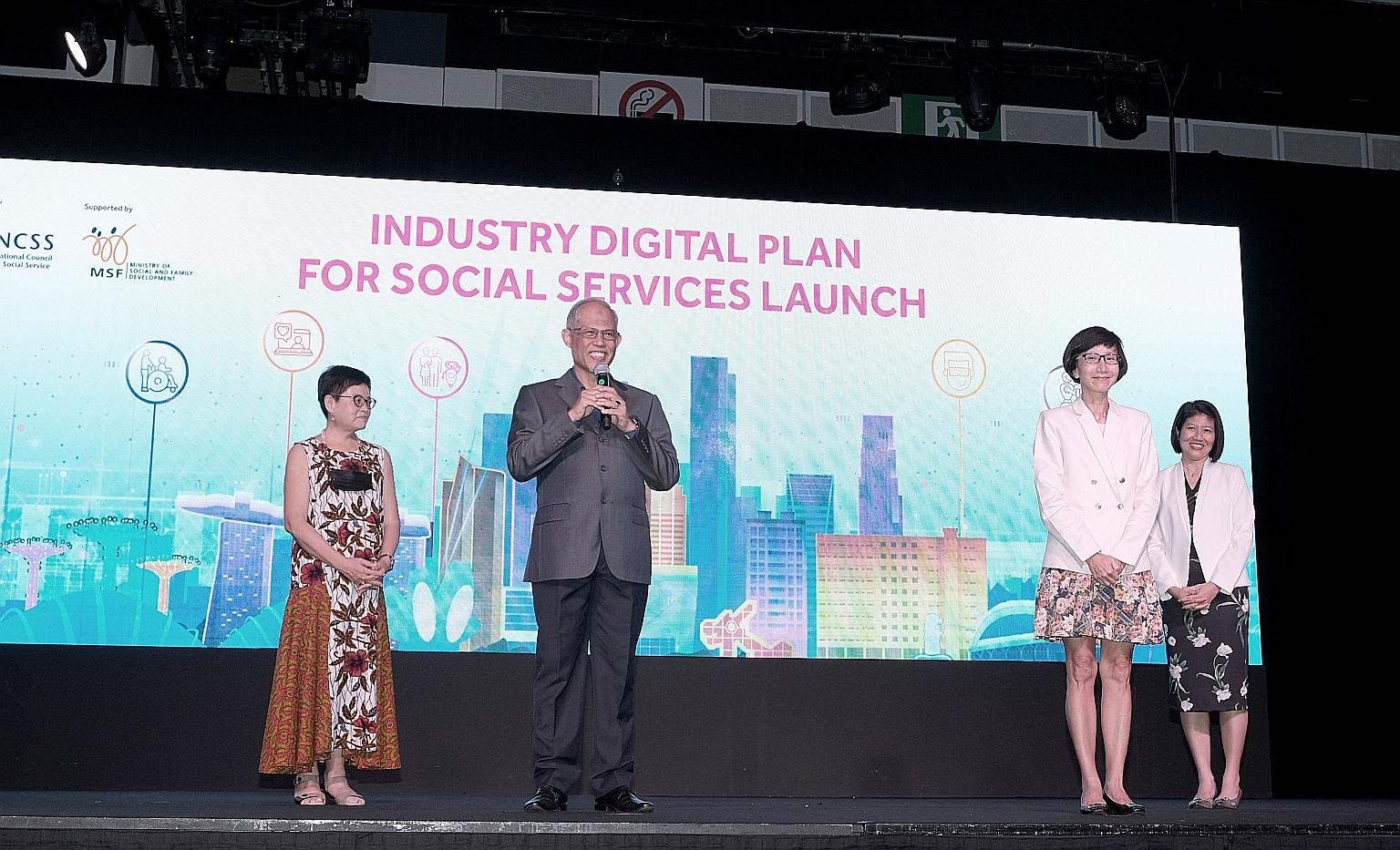 Minister for Social and Family Development Masagos Zulkifli speaking at yesterday's launch of a road map that aims to advance the social service sector's digital capabilities. He is flanked by (from left) National Council of Social Service (NCSS) pre