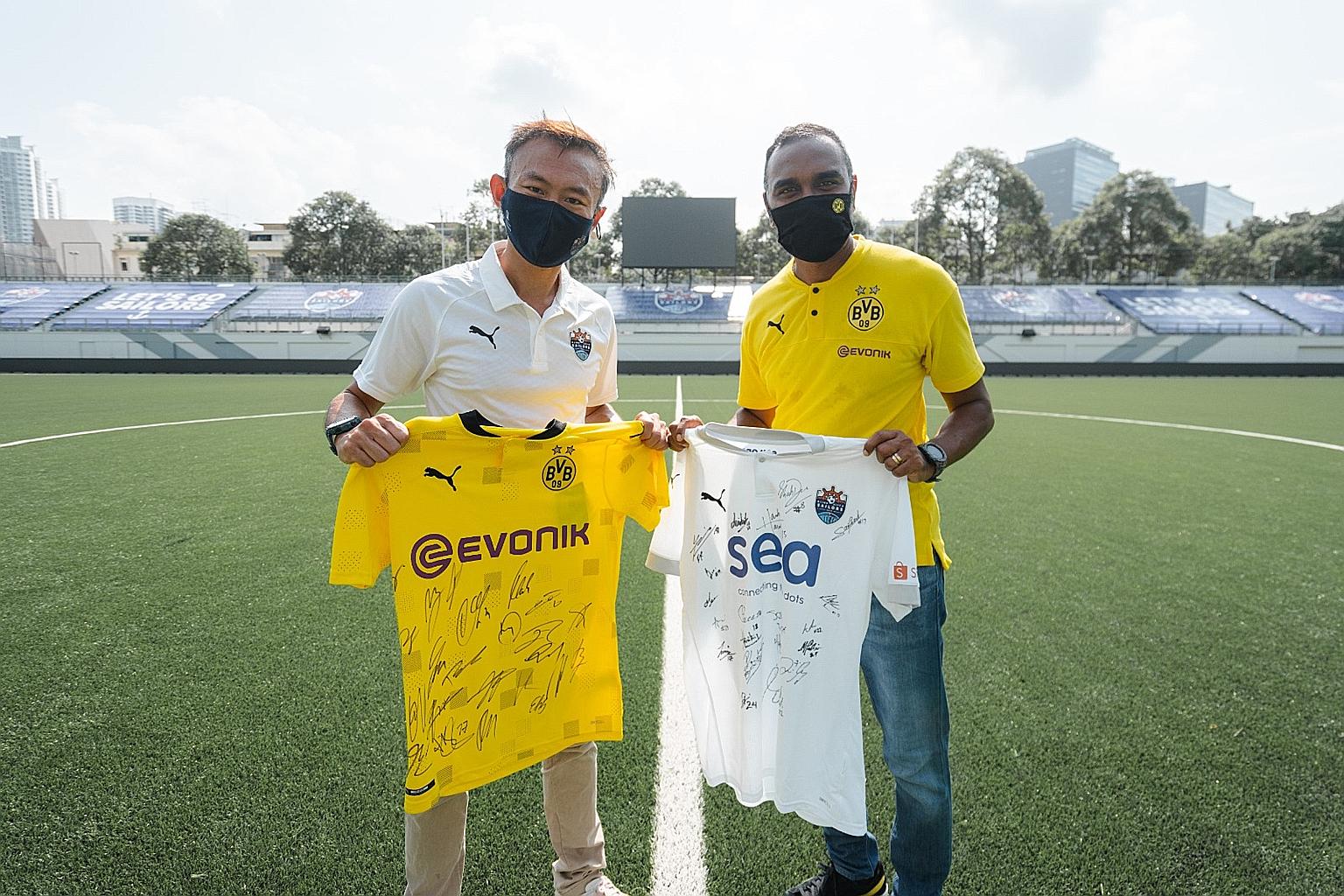 Lion City Sailors chief executive officer Chew Chun-Liang and Suresh Letchmanan, managing director of BVB Asia Pacific, commemorating the signing of the partnership of the two clubs. PHOTO: LION CITY SAILORS