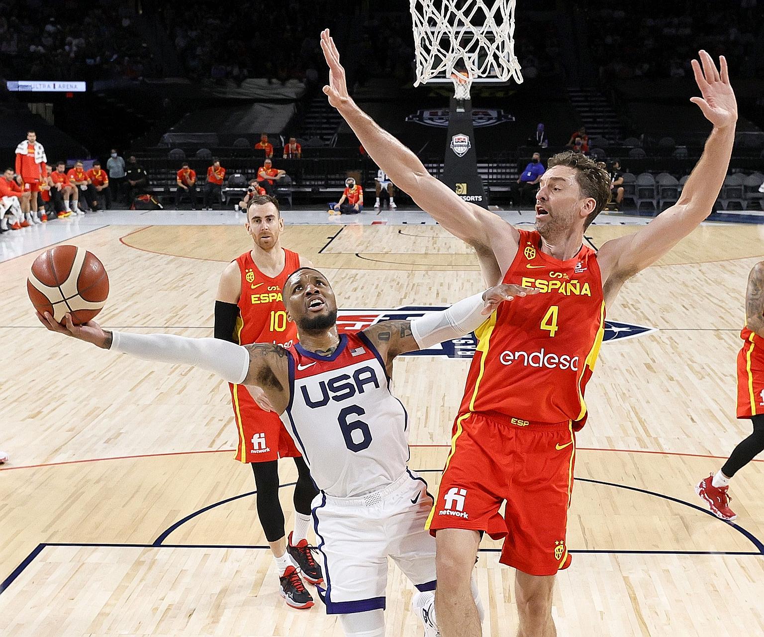 Damian Lillard attempting a basket as Pau Gasol goes for the block in a pre-Olympic exhibition game in Las Vegas, Nevada. The US beat world champions Spain 83-76. At Rio 2016, the teams took gold and bronze respectively.