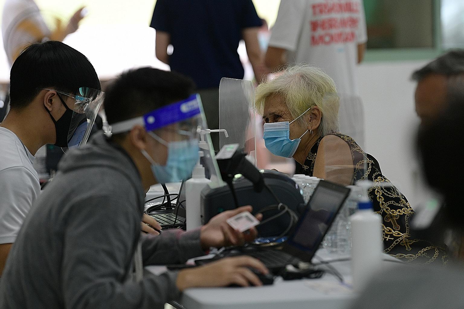 A senior at the vaccination centre at Marsiling Community Club last month. Those who are 60 years old and above can walk into any vaccination centre here and get a Covid-19 jab without a booking.