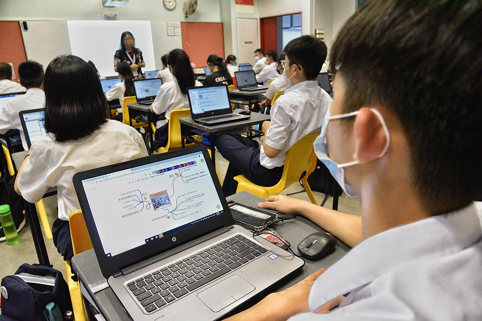 Year 3 students from Dunman High School during a lesson hosted on Singapore Student Learning Space (SLS) in April. The Education Ministry said yesterday that schools will remain open to minimise the impact on learning, but there will be extra safe ma