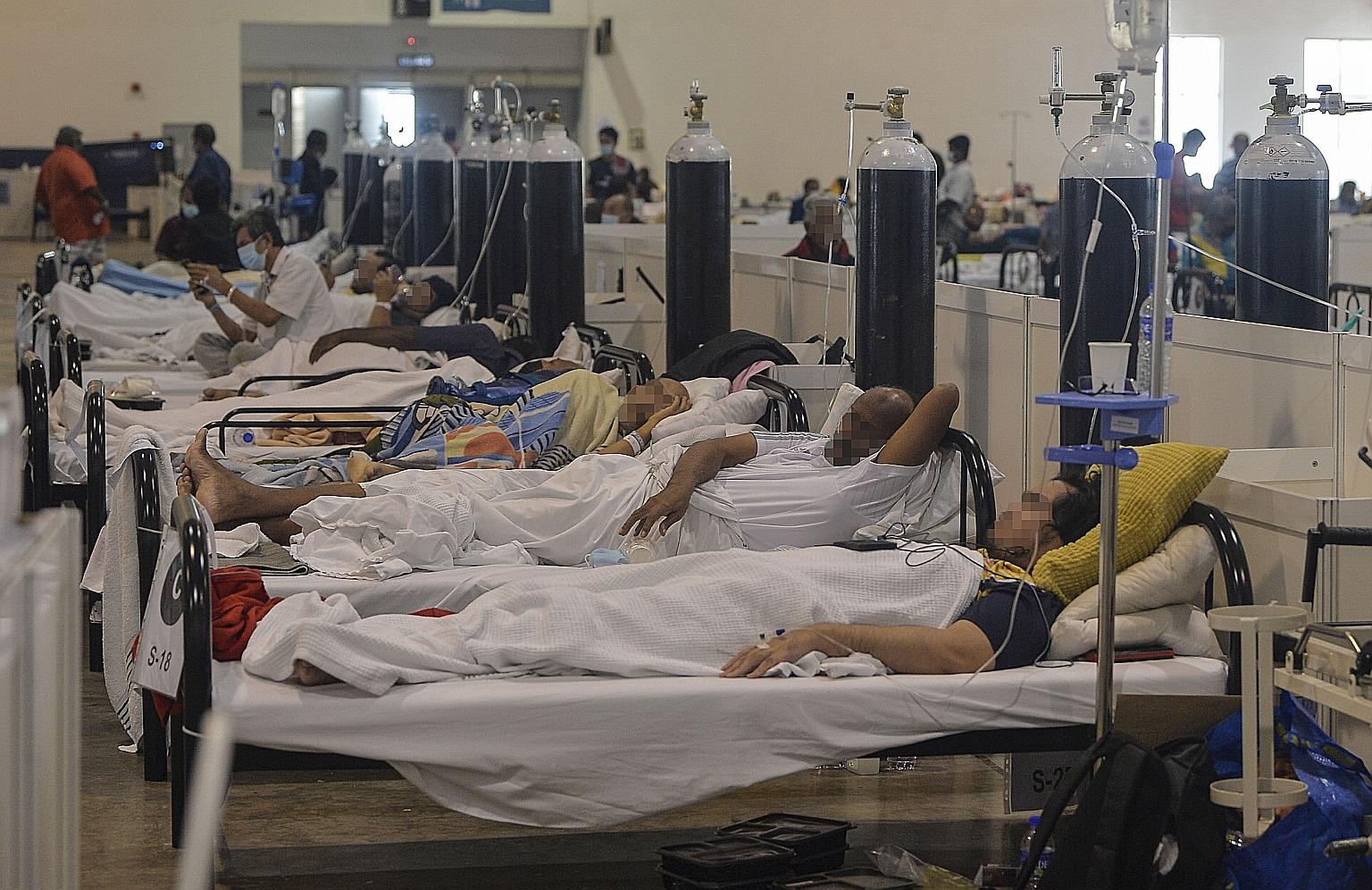 Covid-19 patients at an integrated quarantine and treatment centre in Selangor yesterday. Over 46 per cent of yesterday's reported infections were from Selangor at 5,550 cases. Kuala Lumpur recorded 1,174 cases, out of 11,985 nationwide. PHOTO: BERNA