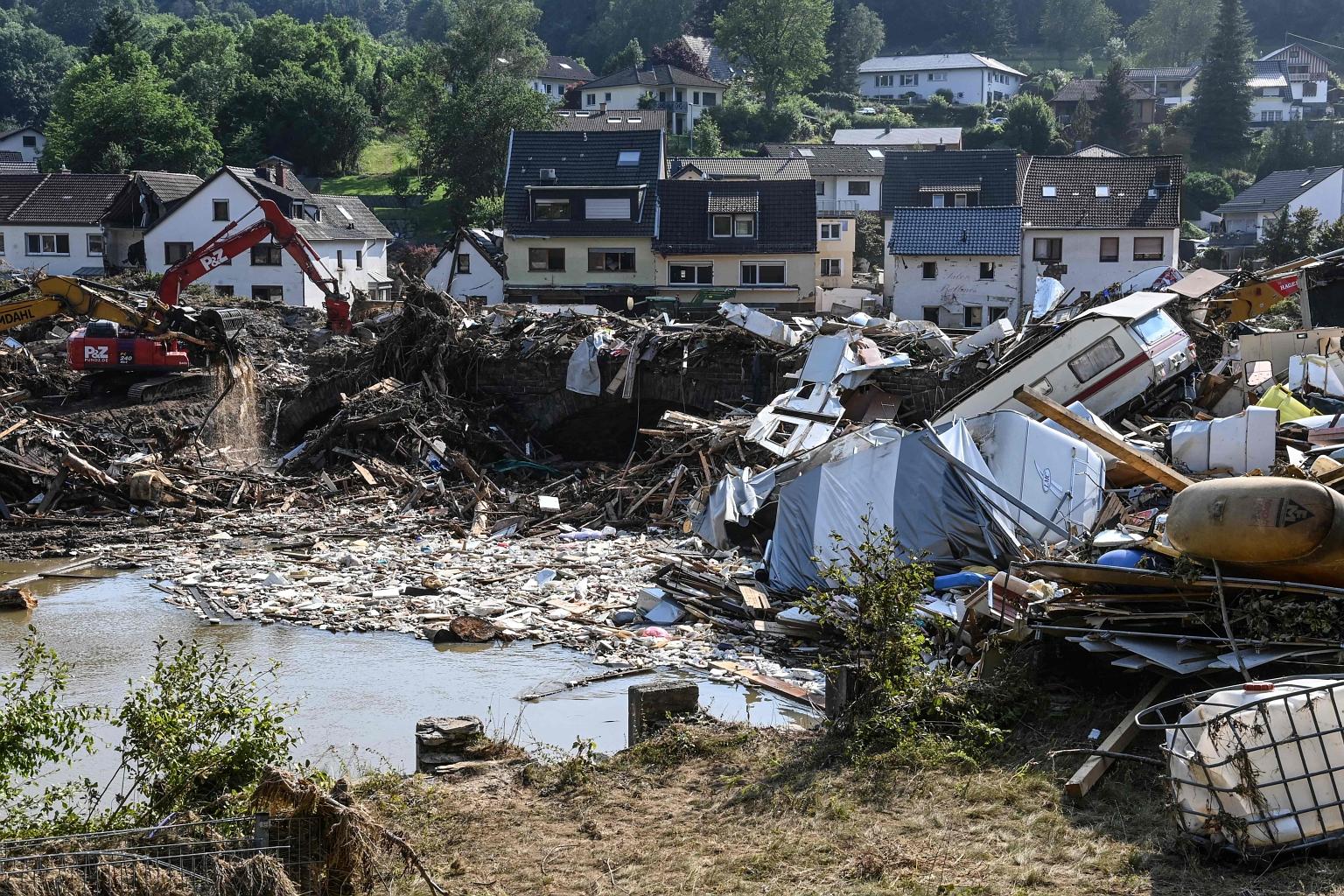 Demolished campers, trash and debris in Kreuzberg, Rhineland-Palatinate, western Germany, on Tuesday, after devastating floods hit the region.