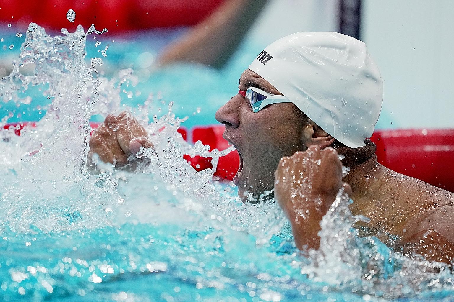 Ahmed Hafnaoui is ecstatic after winning the 400m freestyle at the Tokyo Aquatics Centre. It is Tunisia's third Olympic swimming gold.