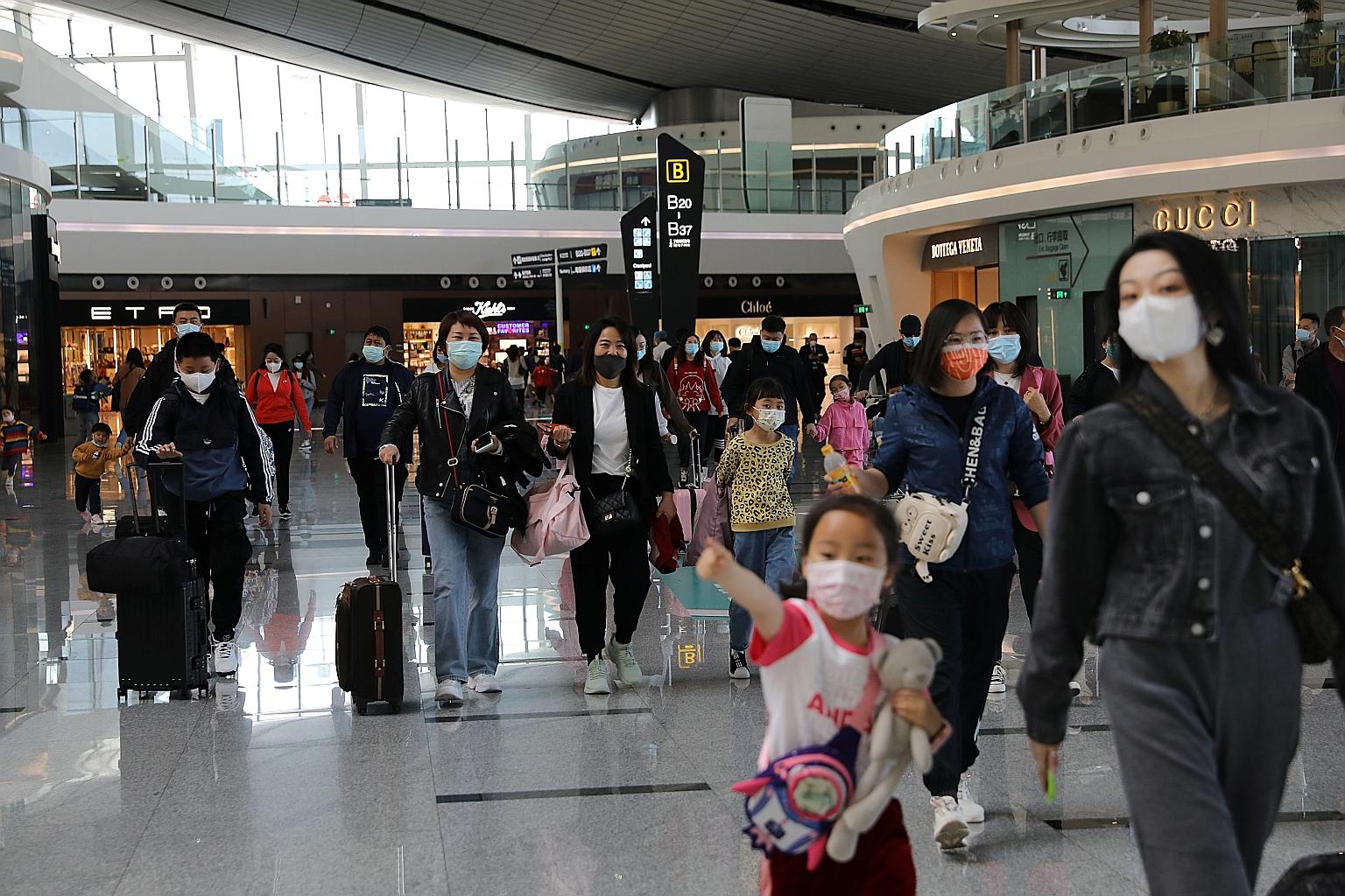 Travellers seen at the Beijing Daxing International Airport on the first day of Labour Day holiday, in Beijing on May 1. Bain found that Asian domestic travel is starting to come back, largely driven by China. PHOTO: REUTERS