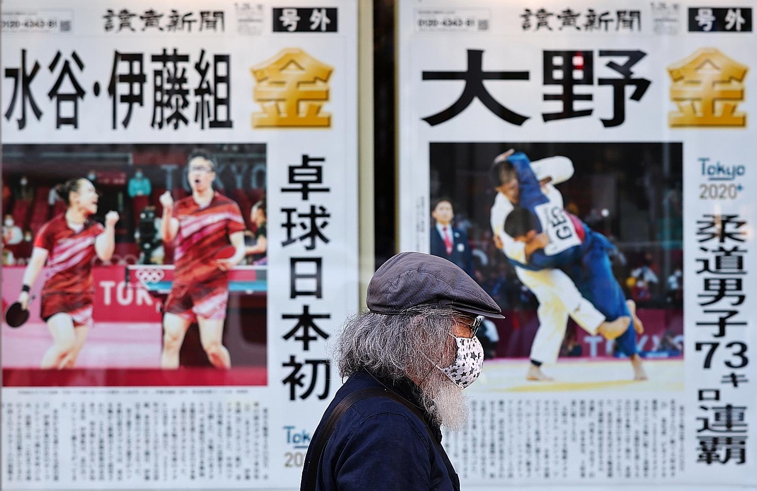 A display of newspaper reports on the Tokyo 2020 Olympic Games in the Japanese capital yesterday - the eighth straight day that Tokyo has logged more than 1,000 cases. The seven-day case average is now up 49.4 per cent from a week ago. PHOTO: REUTERS