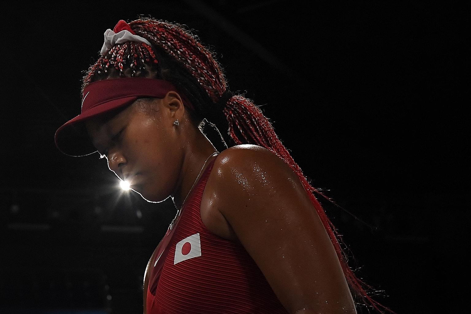 Japan's Naomi Osaka cannot hide her disappointment yesterday after losing 6-1, 6-4 to the Czech Republic's Marketa Vondrousova. PHOTO: AGENCE FRANCE-PRESSE