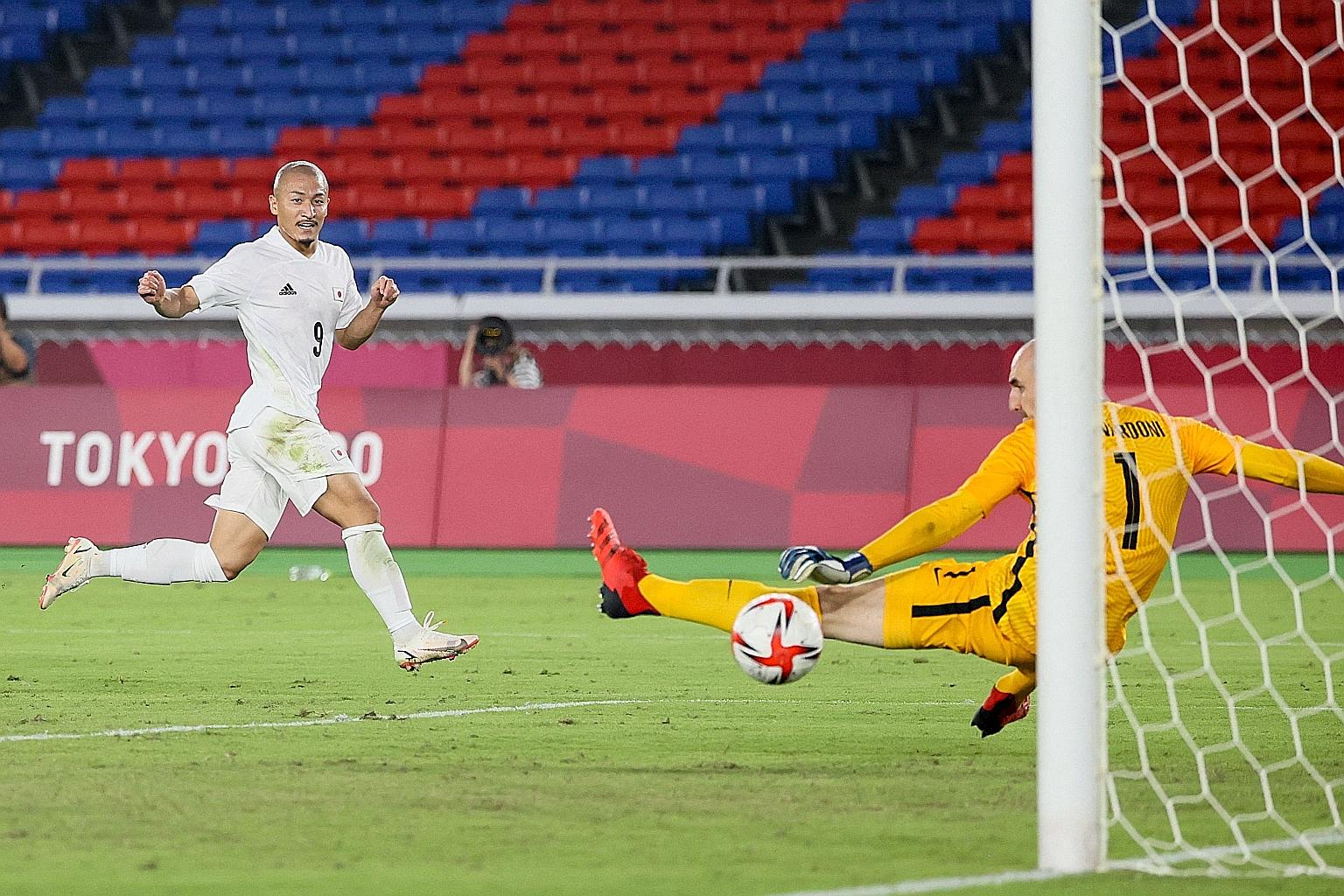 Japan forward Daizen Maeda scoring his team's fourth goal in the 4-0 win over France yesterday. They will next face New Zealand in the last eight on Saturday. PHOTO: AGENCE FRANCE-PRESSE