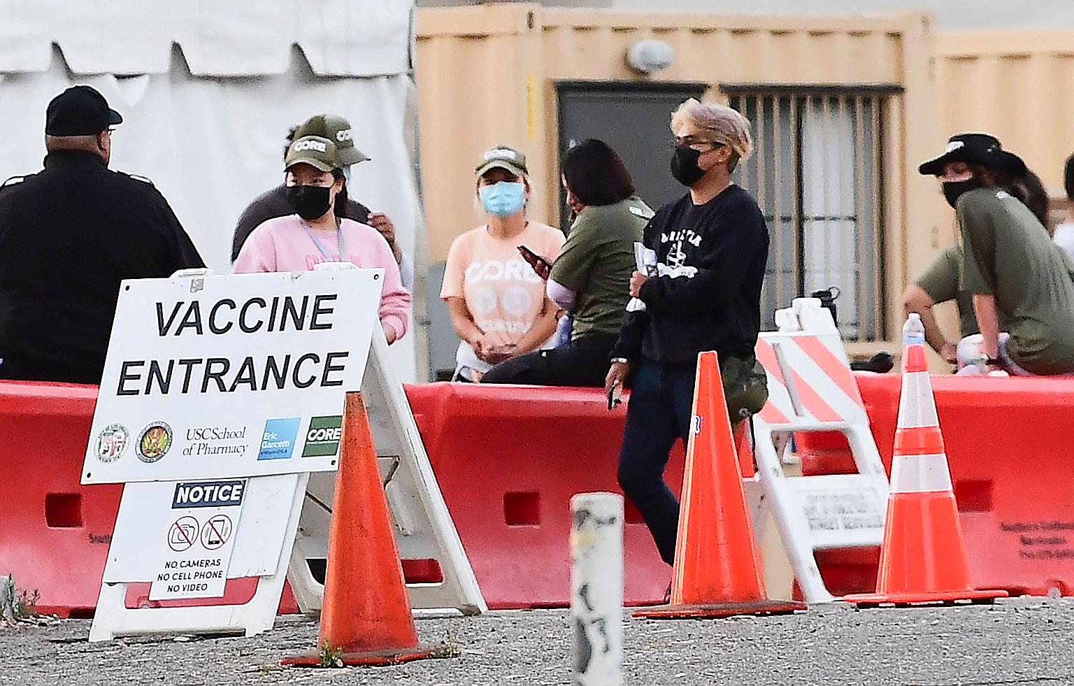 People at a Covid-19 vaccination site in Los Angeles, California, earlier this month. President Joe Biden, who was set to deliver remarks on Covid-19 at the White House yesterday, would not mandate vaccines for federal employees and those who decide 