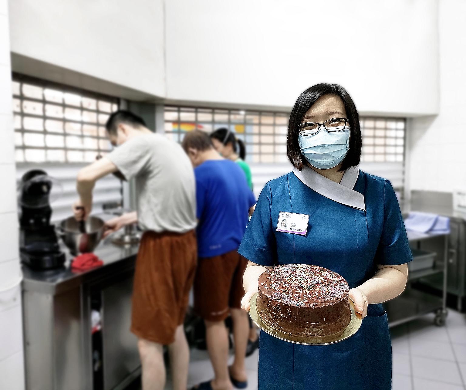Senior nurse manager Hou Yanli with a cake baked by patients who are part of IMH's first intellectual disability inpatient rehabilitation programme. She received the institute's highest award.