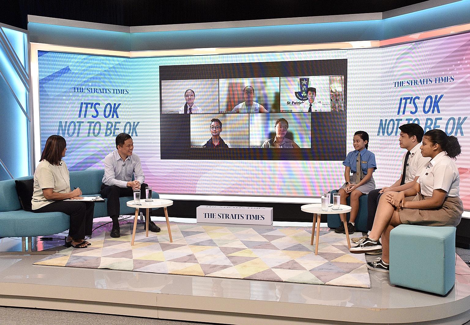 Education Minister Chan Chun Sing, with Straits Times senior education correspondent Sandra Davie as moderator, at Friday's mental well-being dialogue with junior college and secondary school students. During the session, the students also described 