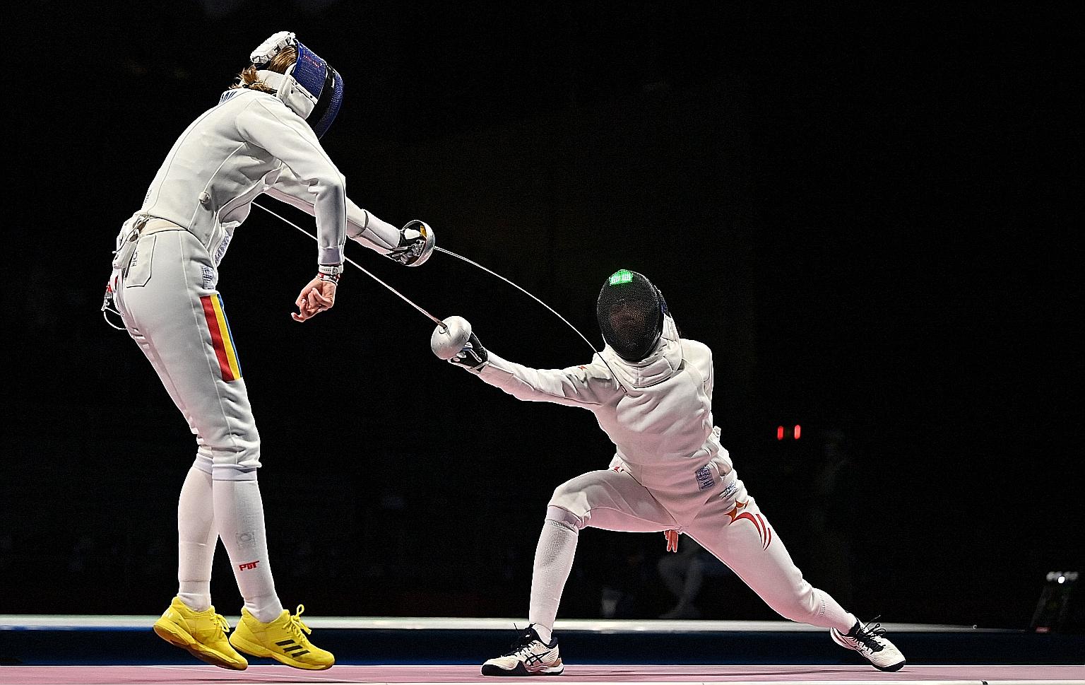 Paddler Yu Mengyu defying her lowly world ranking to set up a bronze-medal play-off before losing to Japan's Mima Ito. PHOTO: AGENCE FRANCE-PRESSE Fencer Kiria Tikanah (far right) competing against world No. 1 Ana Maria Popescu of Romania in their in