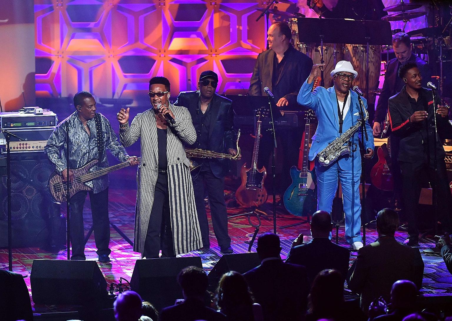 Dennis Thomas (in white hat) performing with Kool & The Gang during the Songwriters Hall of Fame awards dinner in 2018. Thomas died last Saturday at age 70.