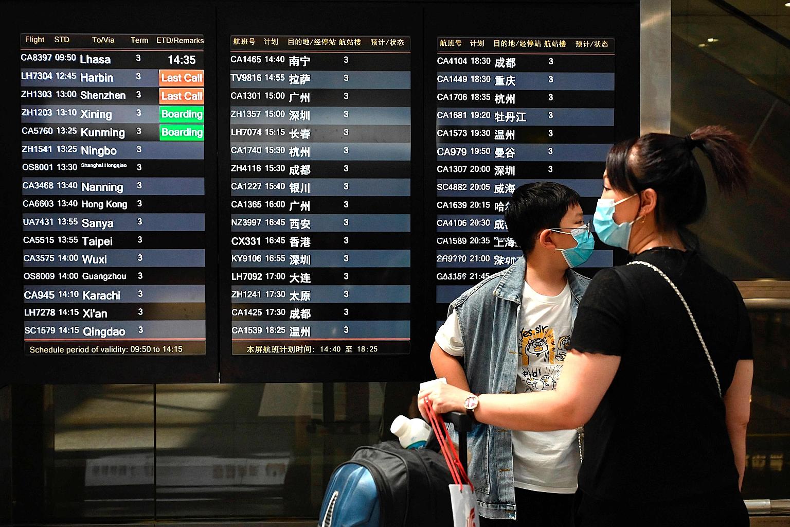 Travellers at Beijing's international airport on Wednesday. Google mobile data capturing the impact of government Covid-19 restrictions on movement shows that flight capacity in China is pointing to a slump in travel, manufacturing in South-east Asia