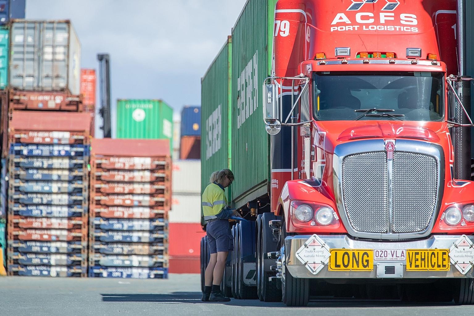 A truck driver checking her paperwork at the Port of Brisbane in April last year. Australia-China ties have been in free fall since April last year, when Canberra called on Beijing to allow independent investigators into Wuhan. That has had repercuss