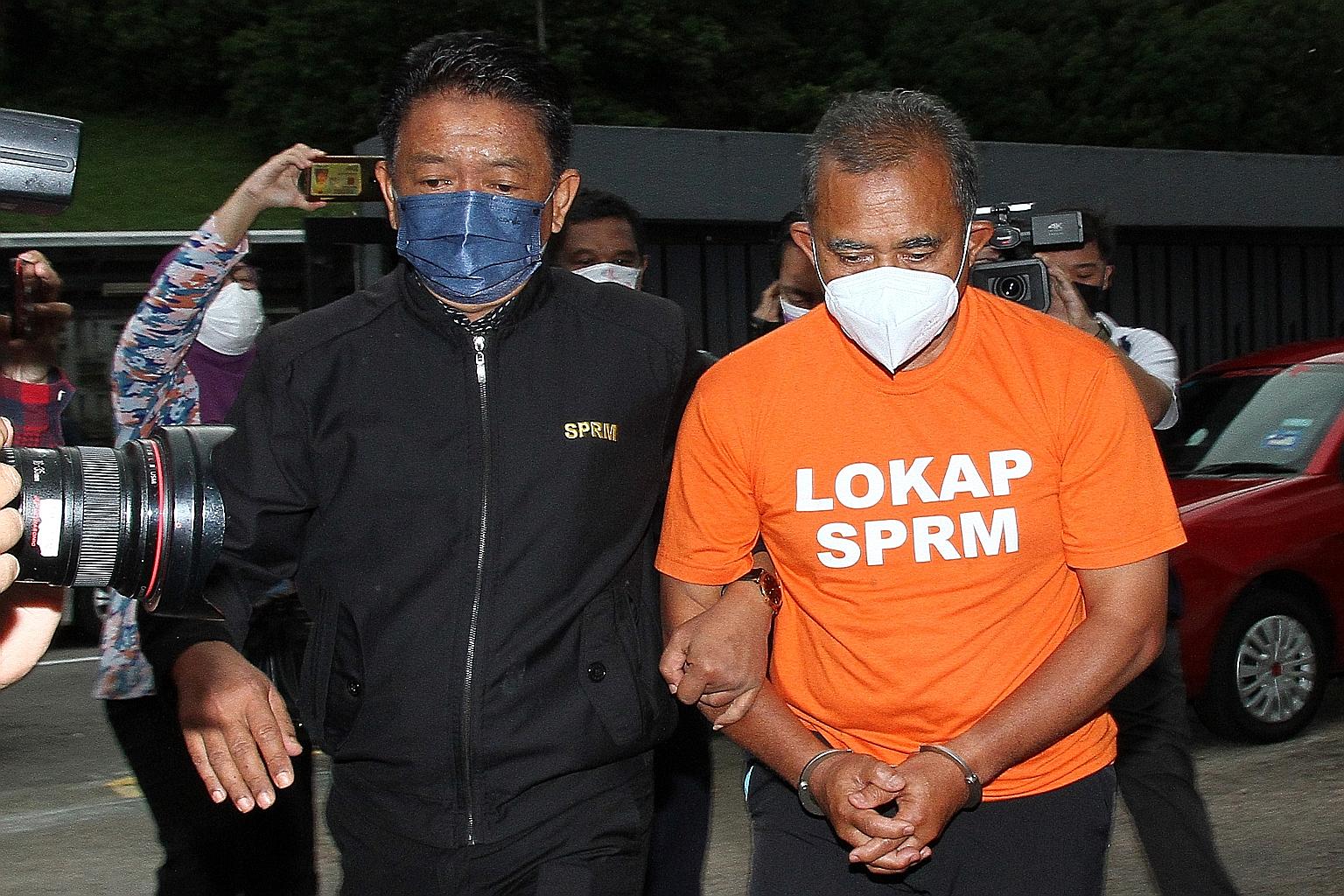 Johor Baru City Council mayor Adib Azhari Daud being led to court in Johor Baru yesterday. This is the first time in the Malaysian state that a sitting mayor has been arrested for alleged bribery.
