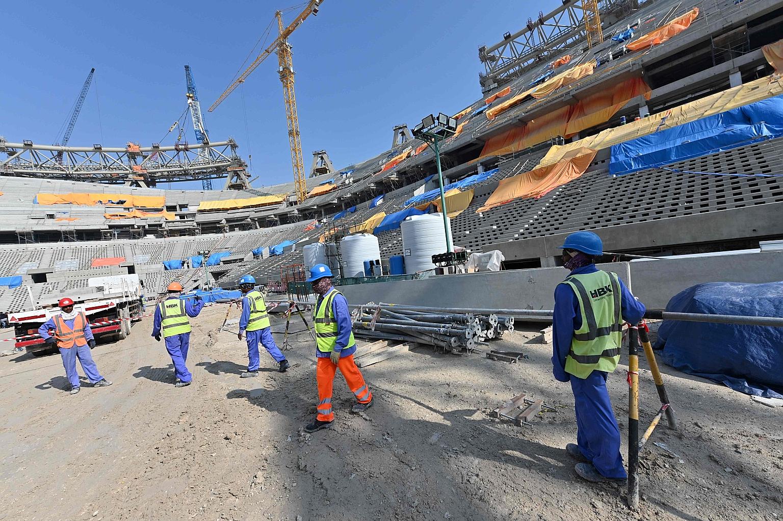 Construction work in 2019 on a stadium in Lusail for the 2022 World Cup. While some projects have been delayed by the pandemic, the organisers have assured that preparations will be finished in time.