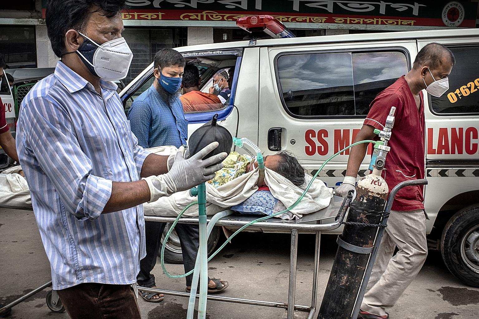 A Covid-19 patient in critical condition being transferred to Dhaka Medical College Hospital on Aug 4. Bangladesh's already strained healthcare system is buckling under the ferocity of the country's third, and by far deadliest, wave of coronavirus in
